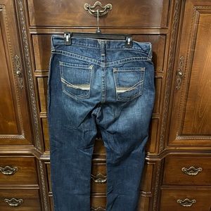 3 pair Ariat Boot cut jeans. The jeans are in good condition with minimal wear.